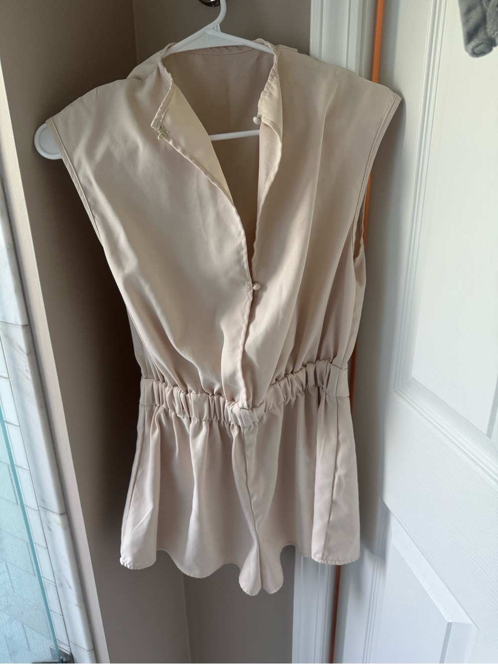 Sleeveless Cream V-Neck Peplum Romper
